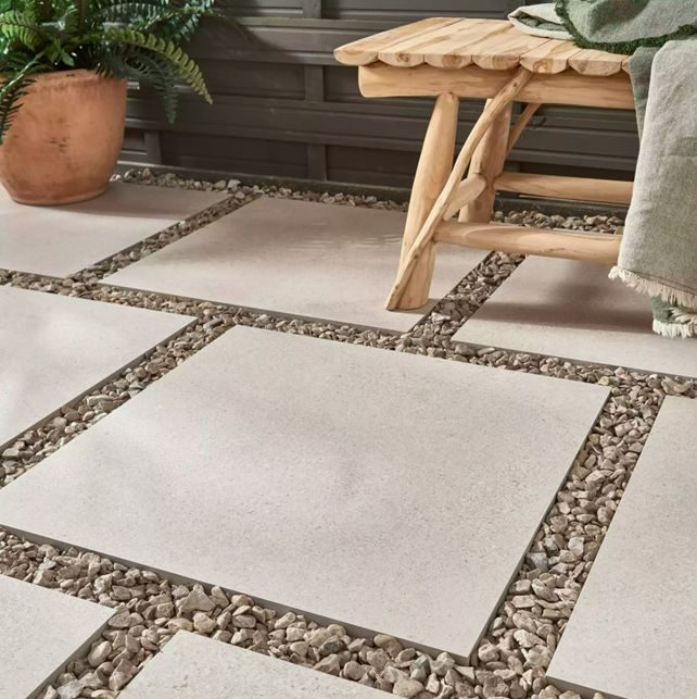 Homestone Sand Outdoor tile laid as paving slabs on pebbles